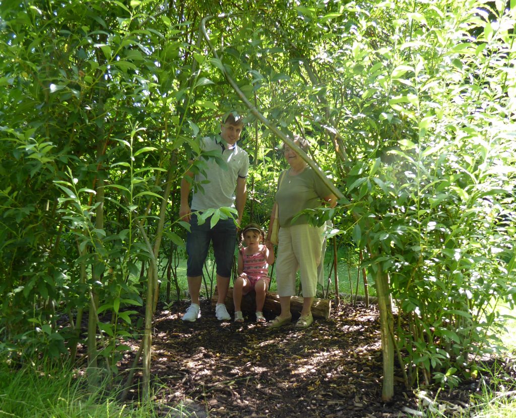 Three generations enjoying the willow dome