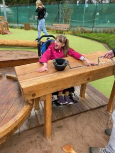 Child in a wheelchair using the sandtray